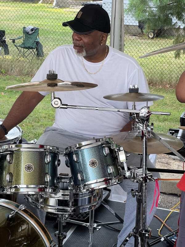 Starban drummer at his Gretsch drum kit backstage