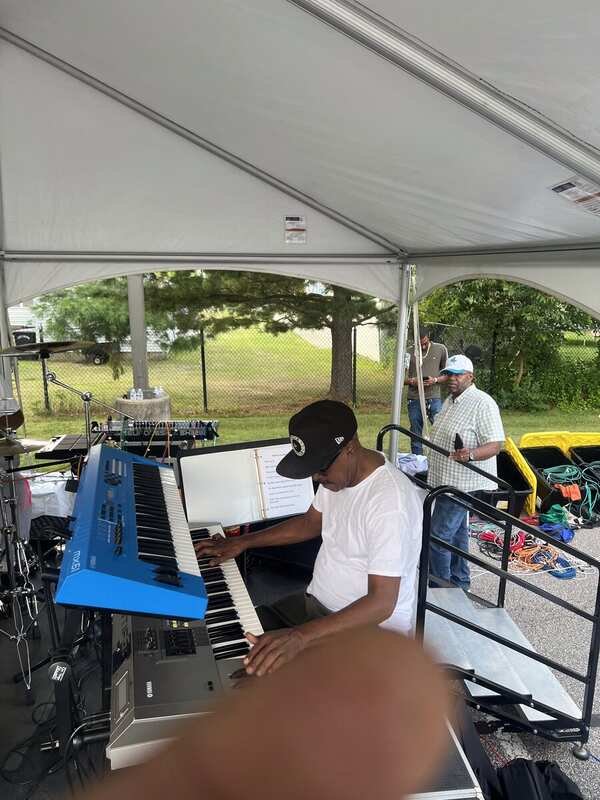 Starban keyboardist rehearsing on stage